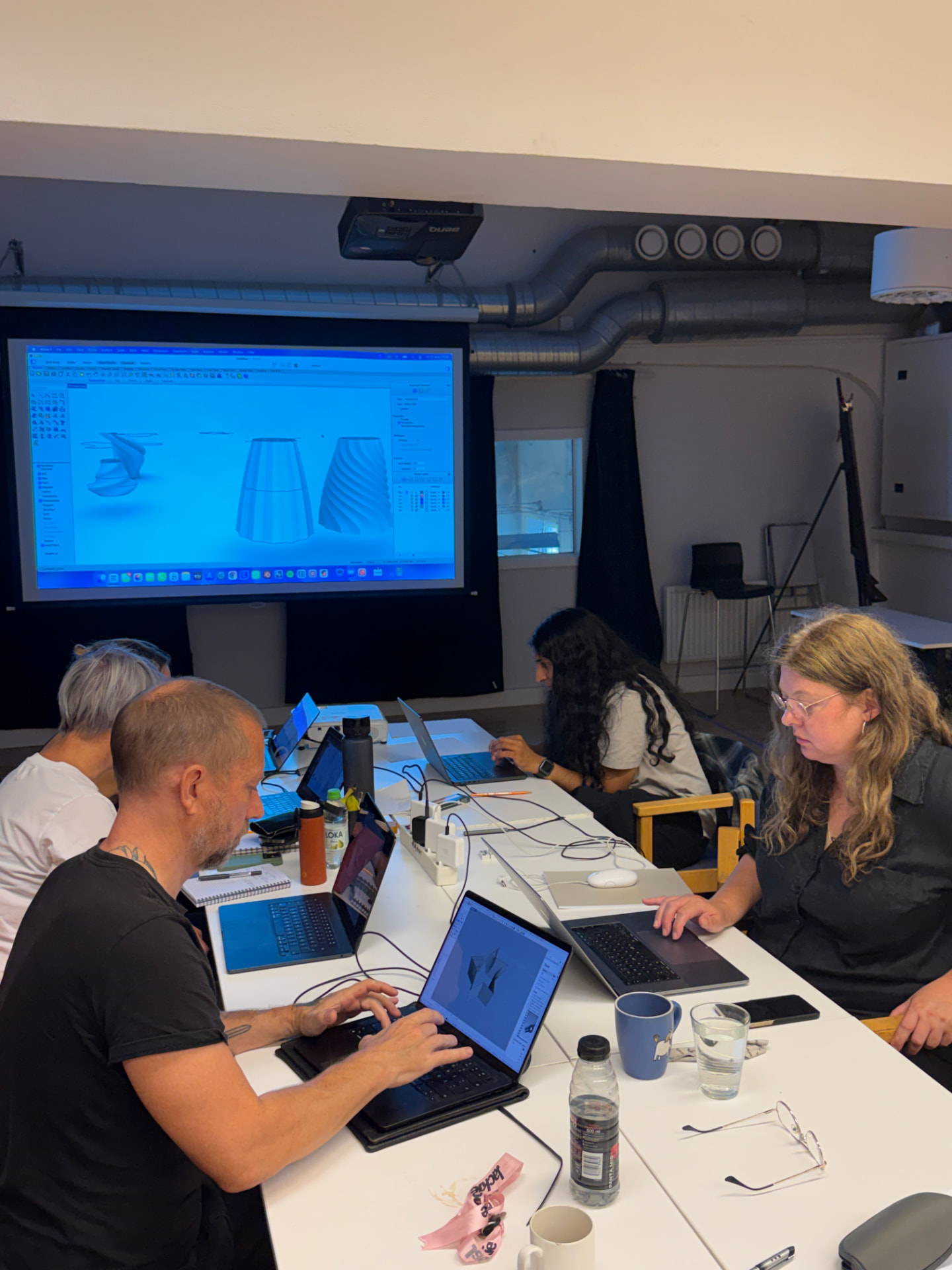 Participants modelling 4D printed textile forms during the 3D-printing workshop at KKV Monumental.